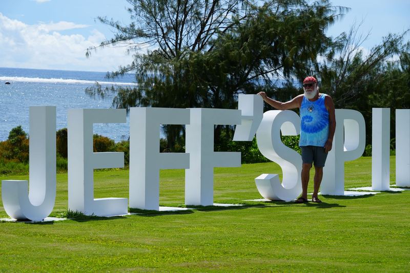 Jeff Pleadwell beside the giant JEFF'S letters on the lawn above the Pacific