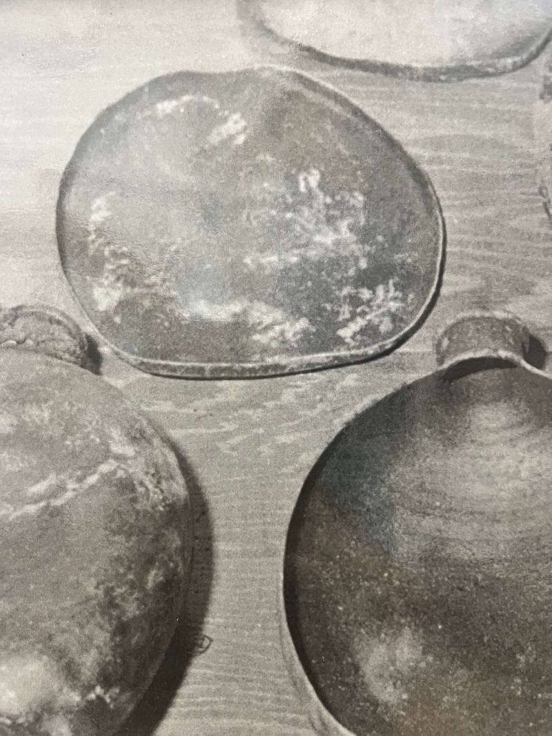 Round handmade bowls on a wooden surface