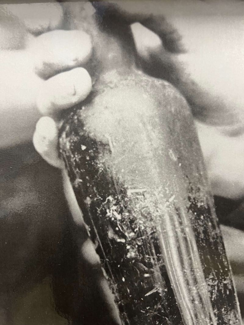 A closer view of the handmade canteen held in a hand